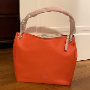Kate Spade shoulder bag. Coral buds is name of color. Not quite orange…
